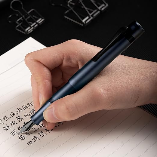 HONGDIAN M2 Mini Blue Fountain Pen with Posted Cap with Writing Pose with Paper Background
