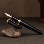 HONGDIAN 1841 Black Fountain Pen Open Cap Display and Cap Beside Pen on Stone Support 
