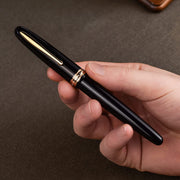 HONGDIAN 1841 Black Fountain Pen with Closed Cap on Hand 
