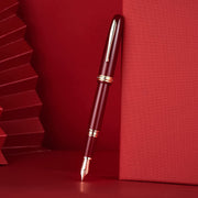 HONGDIAN 1841 Red Fountain Pen with Posted Cap Support on Red Colour Canvas with Horizontal Angle