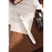 HONGDIAN 1841 White Fountain Pen with Posted Cap with Paper on Background