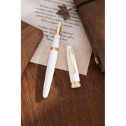 HONGDIAN 1841 White Fountain Pen Open Cap Display and Cap Beside Pen with Paper on Background