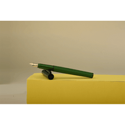 HONGDIAN H2 Green Fountain Pen Open Cap Display and Cap Beside Pen with Cream Background and Pen Support with Paper Yellow Box with Diffrent Angle 
